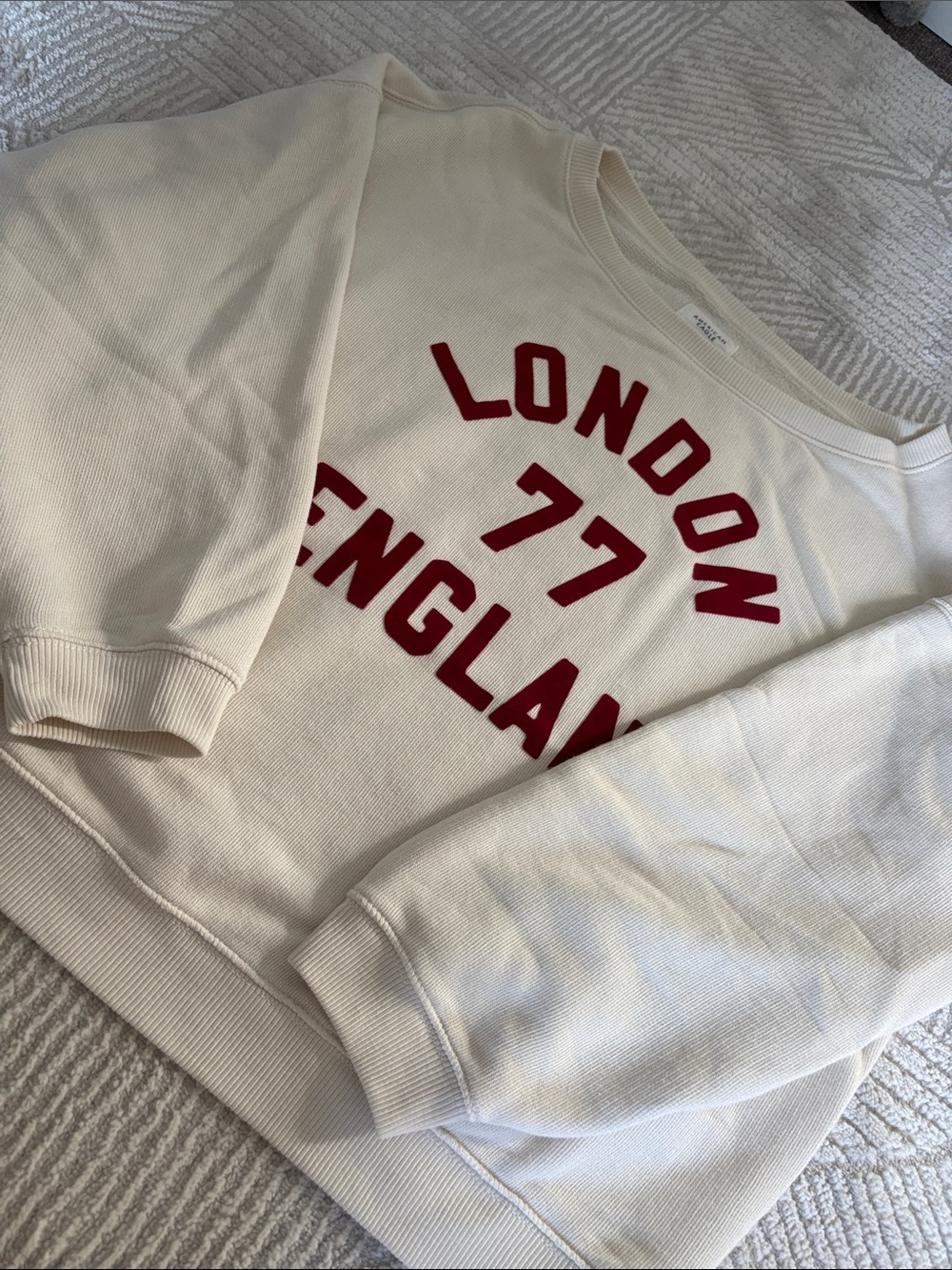 American Eagle Cream Off-Shoulder Sweatshirt with Burgundy Lettering
